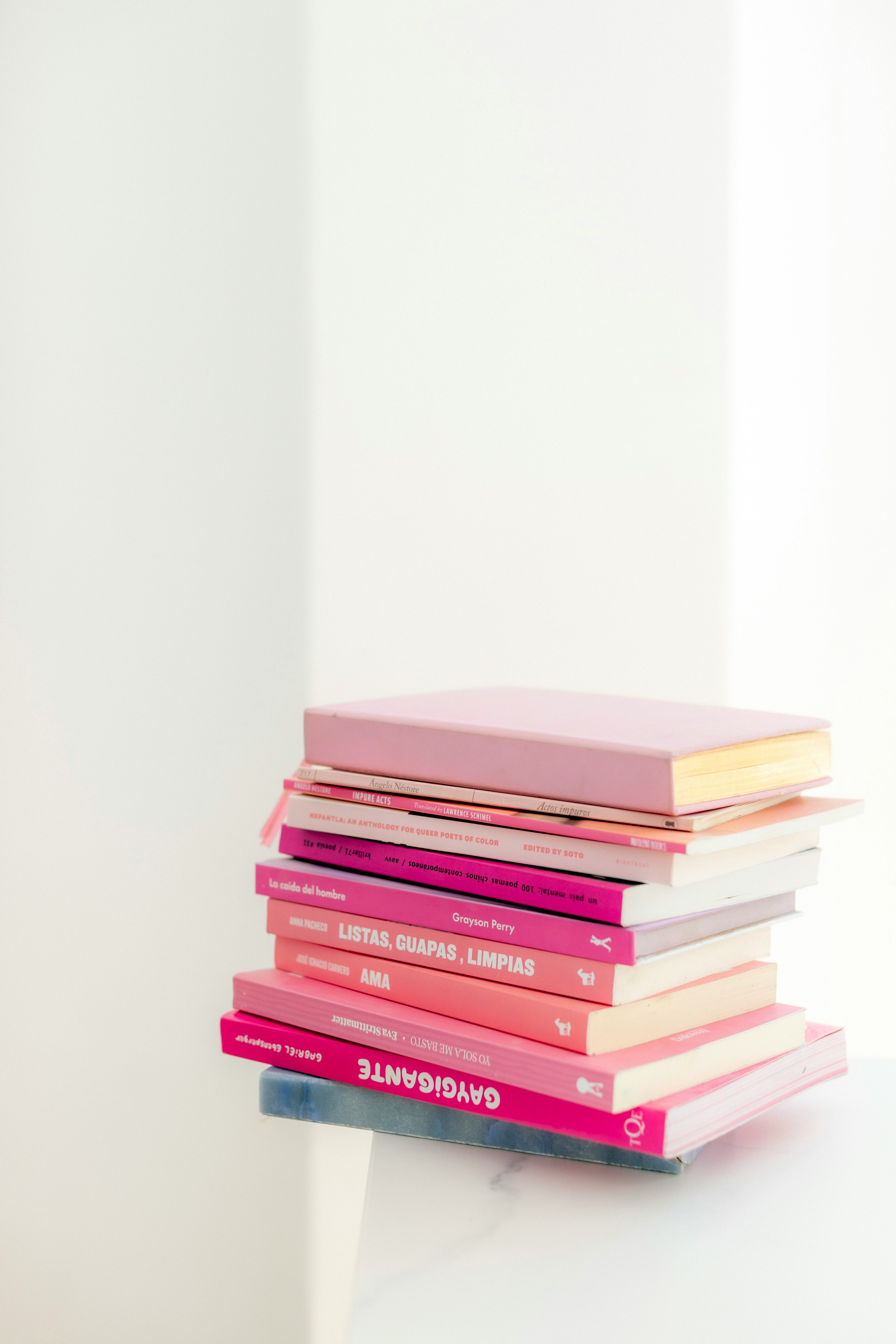 stack of books on white table